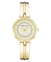 Anne Klein Women's Three Hand Quartz Gold-tone Alloy Bangle Watch, 30mm - Gold