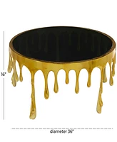Rosemary Lane Aluminum Drip Coffee Table with Melting Designed Legs and Shaded Glass Top, 36" x 16"