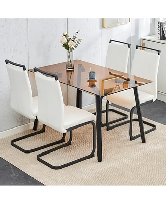 Streamdale Furniture Table and chair set. Large modern rectangular table with brown glass top and black metal legs. It is equipped with soft and comfo