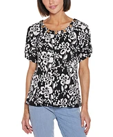 Belldini Women's Grommet Detail Floral Short Sleeve Knit Top