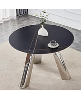 A 42-inch burn stone round table with stainless steel legs can accommodate 4 or 6 diners