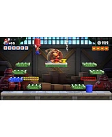 Nintendo Switch White Oled Console with Mario vs. Donkey Kong, MightySkins Console and Controller Skin Voucher