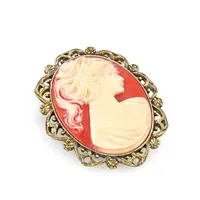 2028 Gold-Tone Simulated Orange Cameo Oval Brooch