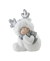 Northlight 12.5" Smiling Child in White Reindeer Snow Suit Christmas Tabletop Decoration