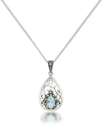 Blue Topaz Open Work Teardrop Pendant and a Curb Chain