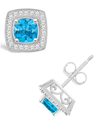 Macy's Blue Topaz (1-1/2 ct. t.w.) and Diamond (1/5 ct. t.w.) Halo Studs in Sterling Silver