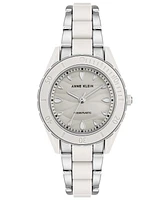 Anne Klein Women's Solar Silver-Tone and White Oceanworks Plastic Watch, 32mm