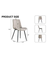 Light gray artificial leather backrest cushion dining chair, black metal legs, curved widened cushion design for more comfort, suitable for restaurant