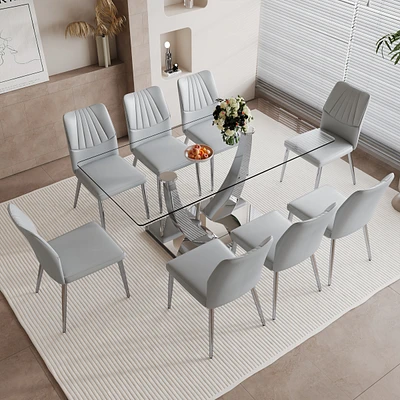 Streamdale Furniture Table and chair set.Contemporary, minimalist rectangular dining table featuring a clear tempered glass top and sleek silver legs.