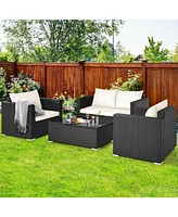 Gouun 4 Pieces Patio Rattan Conversation Set with Padded Cushion and Tempered Glass Table