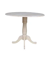 International Concepts 42" Round Dual Drop Leaf Pedestal Table