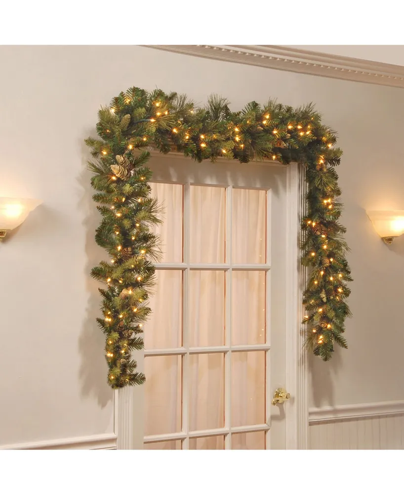 National Tree Company 9' x 10" Carolina Pine Garland with 27 Flocked Cones and 100 Clear Lights