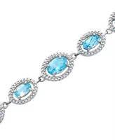 Blue Topaz (7-3/8 ct. t.w.) & Diamond (1/10 ct. t.w.) Link Bracelet in Sterling Silver