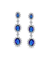 Bling Jewelry Long Royal Blue Triple Oval Halo Simulated Sapphire Cz Chandelier Earrings For Women Cubic Zirconia Rhodium Plated Brass