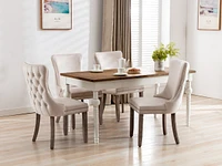 2 Beige Wingback Dining Chairs with Nailhead Trim & Wood Legs