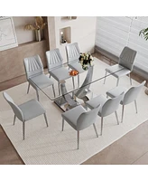 Streamdale Furniture Table and chair set.Contemporary, minimalist rectangular dining table featuring a clear tempered glass top and sleek silver legs.