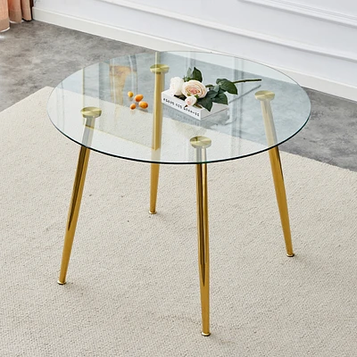 Streamdale Furniture A glass tabletop with a diameter of 40 inches and a modern minimalist circular dining table with gold plated metal legs. 40 ' 40'