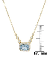 Lab Grown Blue Topaz (2-3/8 ct. t.w.) & Lab Grown White Sapphire (1/4 ct. t.w.) Halo & Bezel 18" Pendant Necklace in 14k Gold-Plated Sterling Silver