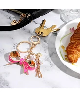 Juicy Couture Bow Charm Keychain – Stylish Gold & Pink Bling Accessory