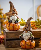 Gerson International 8.8" Harvest Gnomes Sitting on Pumpkins Set, 2 Pieces