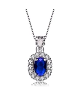 Genevive Sterling Silver White Gold Plated with Blue Oval Cubic Zirconia Accented Clear Pear and Round Cubic Zirconias Necklace