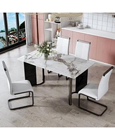 White marble table set with 4 chairs