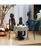 LuxenHome Modern Brown Polyresin Couple Date Night Tabletop Home Decor