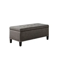 Modern tufted storage bench with soft-close lid, grey linen upholstery, button tufting, black wood legs, and interior for bedroom or entryway.