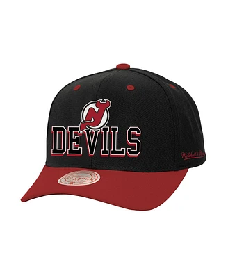 Mitchell & Ness Men's Black/Red New Jersey Devils Backside Script 2-Tone Pro Crown Adjustable Hat