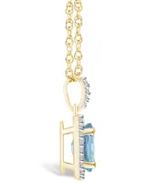 Lab Grown Spinel Aquamarine (1-1/4 ct. t.w.) and Lab Grown White Sapphire (1/6 ct. t.w.) Halo Pendant Necklace in 10K Yellow Gold