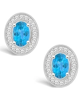 Macy's Blue Topaz (1-1/7 ct. t.w.) and Diamond (1/5 ct. t.w.) Halo Studs in Sterling Silver