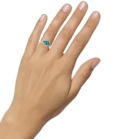 Blue Topaz (1-1/3 ct. t.w.) & Diamond (1/20 ct. t.w.) Swirl Ring in 10k Gold