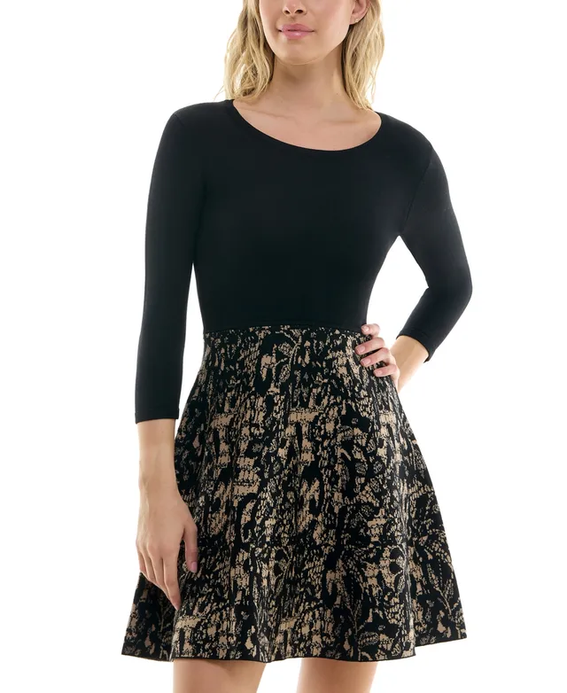 sweater dress with lace skirt a chic way to style a lace dress when it's cold out