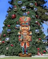 Designocracy Nutcracker with a Heartwarming Surprise 32" Outdoor Holiday Lawn Decor G. DeBrekht