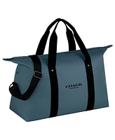 Free Coach for Men Blue Weekend Bag with $128 purchase from the Coach for Men's fragrance collection