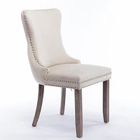 2 Beige Wingback Dining Chairs with Nailhead Trim & Wood Legs