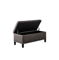 Modern tufted storage bench with soft-close lid, grey linen upholstery, button tufting, black wood legs, and interior for bedroom or entryway.