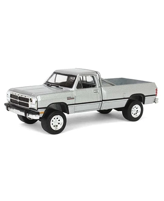 1/64 1992 Dodge Ram D250 Power Ram Lifted Rollbar Silver All-Terrain