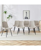 Light gray artificial leather backrest cushion dining chair, black metal legs, curved widened cushion design for more comfort, suitable for restaurant