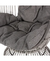 Cozy Swivel Egg Chair: Rattan Haven For Outdoor Relaxation