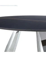 A 42-inch burn stone round table with stainless steel legs can accommodate 4 or 6 diners
