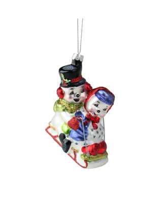 Northlight Cheerful Sledding Snowmen Couple Glass Christmas Ornament