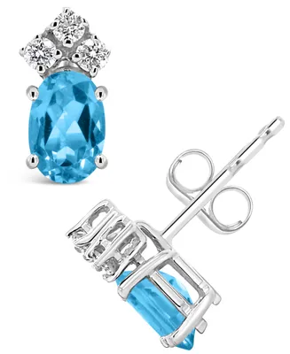 Blue Topaz (1-1/6 ct.t.w) and Diamond (1/8 ct.t.w) Stud Earrings in 14K White Gold