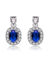 Genevive Sterling Silver White Gold Plated Sapphire Blue Oval Cubic Zirconia with Clear Pear and Round Cubic Zirconias Accent Earrings