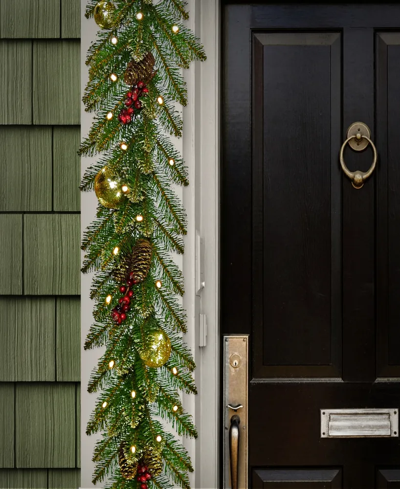 National Tree Company 9'x 10" Glittery Gold Dunhill Fir Garland w/ Red Berries, Gold Edged Cones, Gold Ornaments & Warm White Battery Operated Led Lig