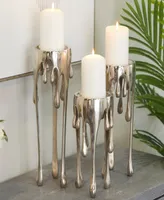 CosmoLiving Aluminum Abstract Pillar Drip Candle Holder with Melting Designed Legs Set of 3 - 12", 10", 8" H