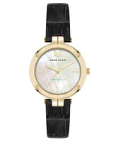 Anne Klein Women's Quartz Consider It Black Leather and Gold-Tone Alloy Metal Band Watch, 32mm