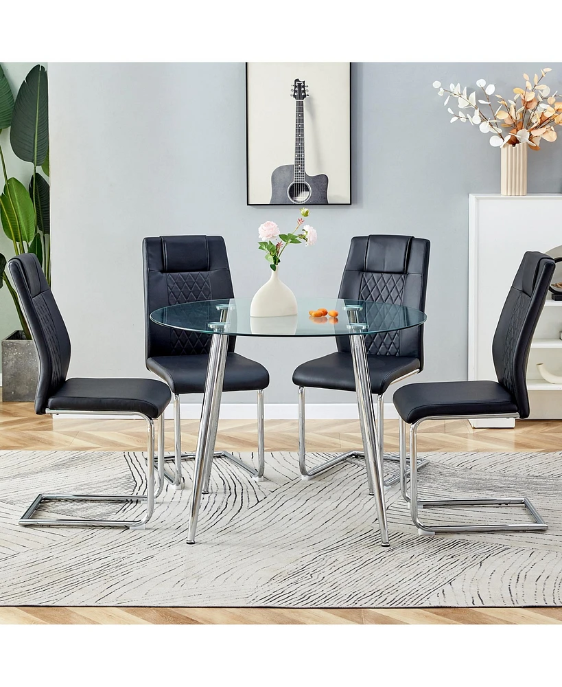 Simplie Fun Table and chair set. (1 table+4 black chairs) Round dining table with a 40 inch diameter glass tabletop and silver plated metal legs. 4 bl