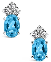 Blue Topaz (1-1/6 ct.t.w) and Diamond (1/8 ct.t.w) Stud Earrings in 14K White Gold