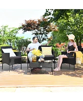 Sugift 4 Pieces Patio Rattan Cushioned Sofa Set with Tempered Glass Coffee Table-Grey